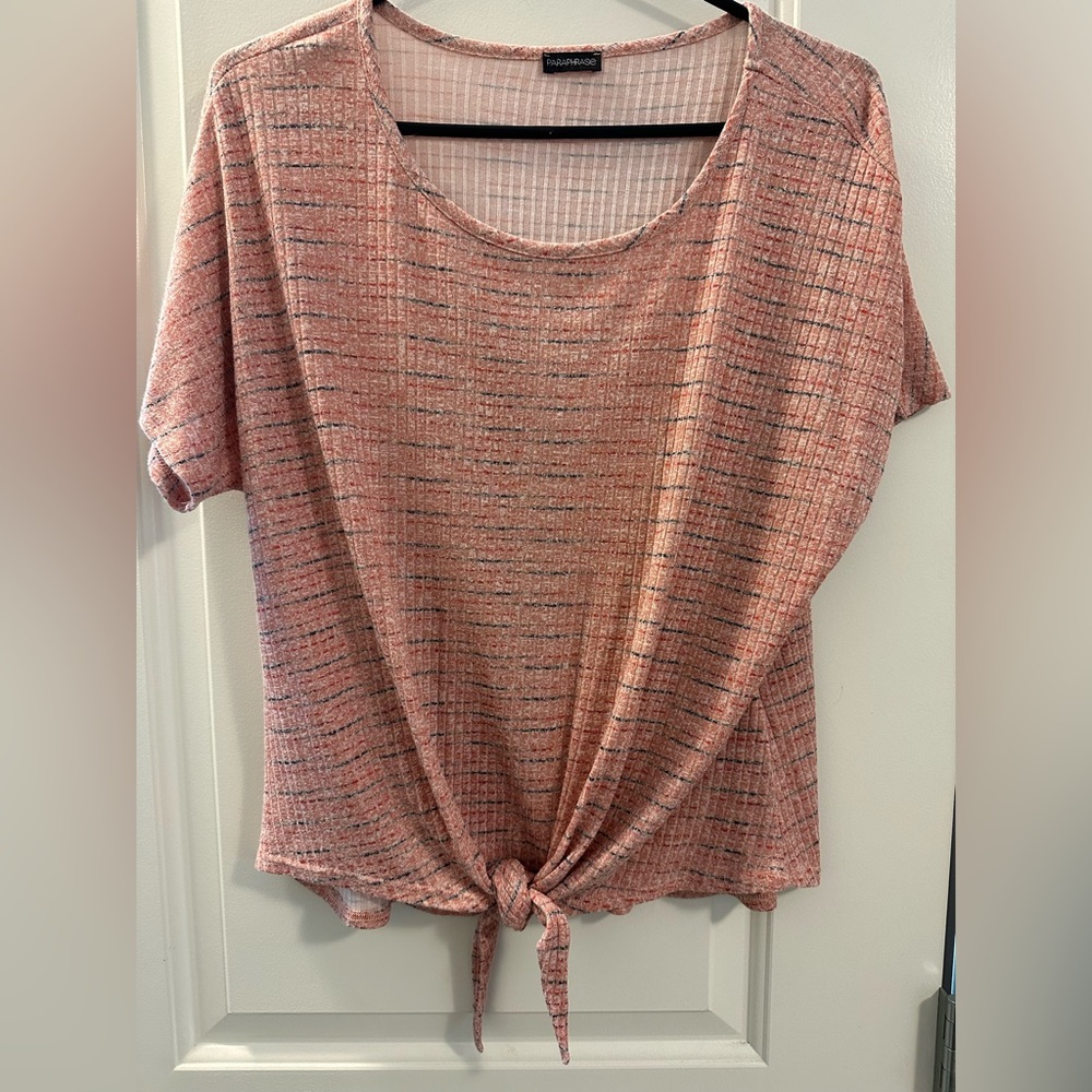 Pink shirt with bottom knot.
